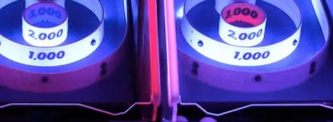 an arcade game in a dark room with led lights.