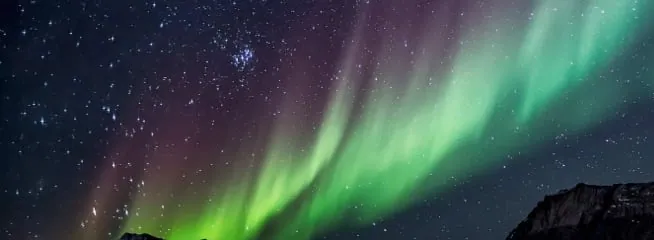 a night sky with many auroras borealis.
